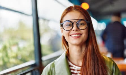 woman-hipster-with-red-hair-and-glasses